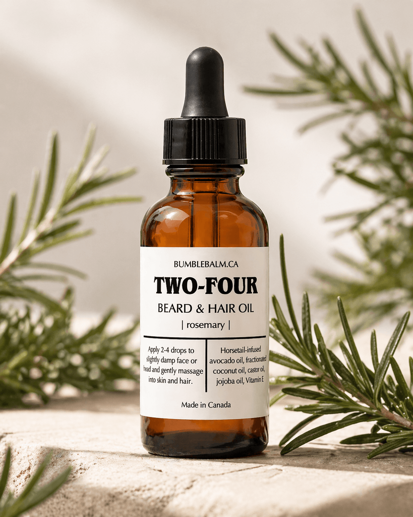 TWO-FOUR rosemary beard oil bottle with rosemary leaves